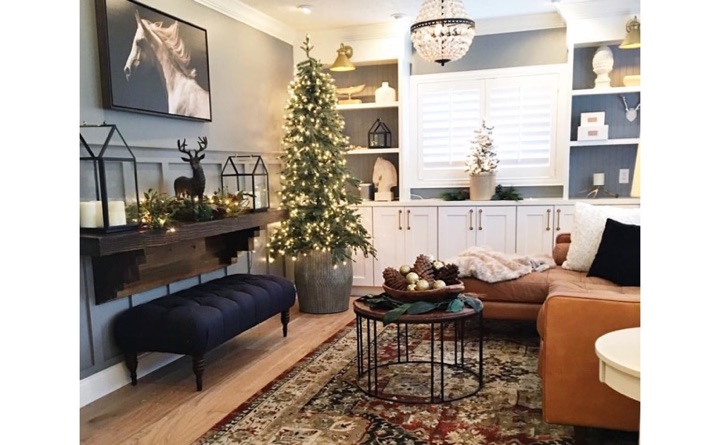 Family room with hardwood floors and plantation shutters.